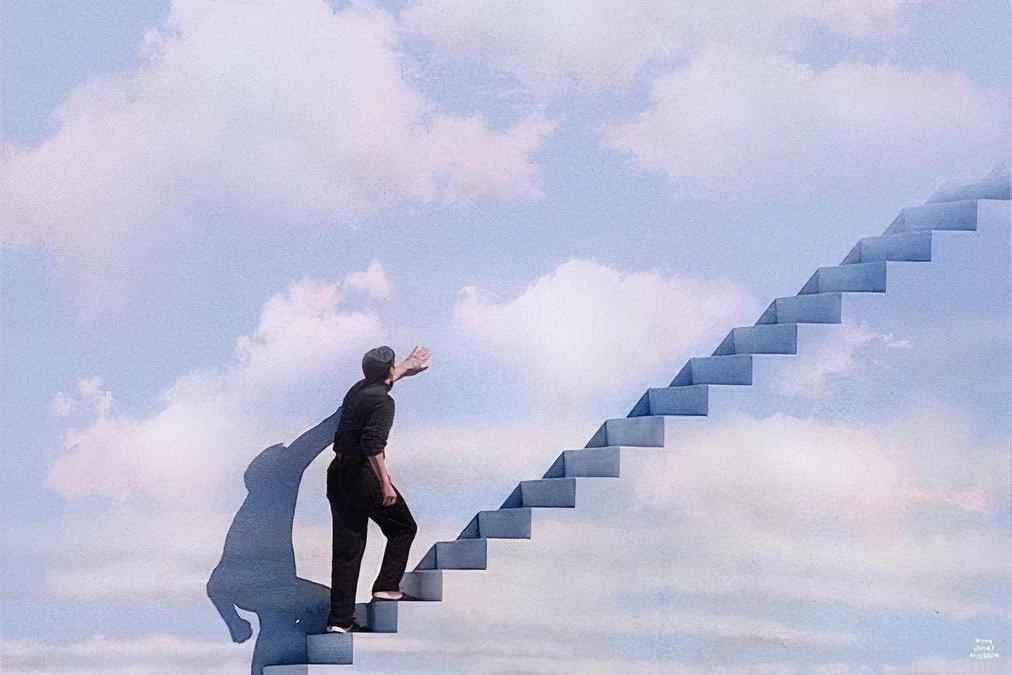 The man is climbing up towards the stairs
